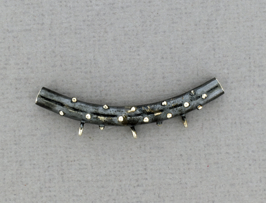 Oxidized, curved tube with three loops PS903